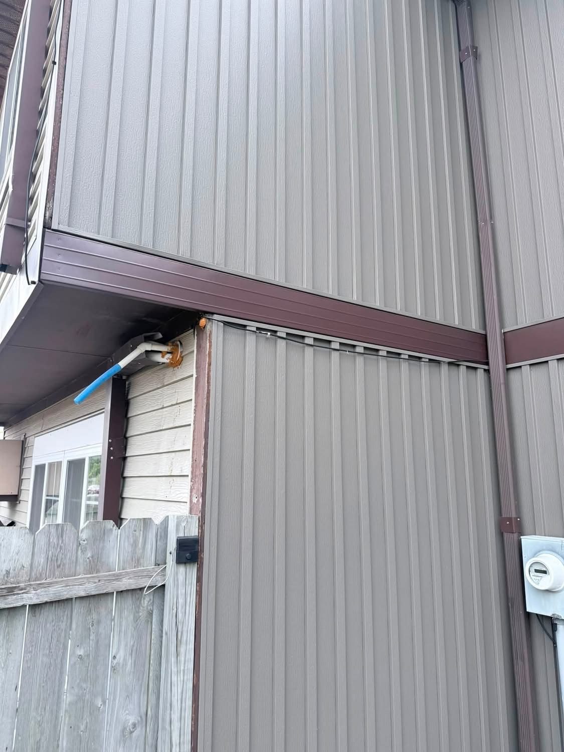 Completed exterior trim repair with new matching metal trim installed